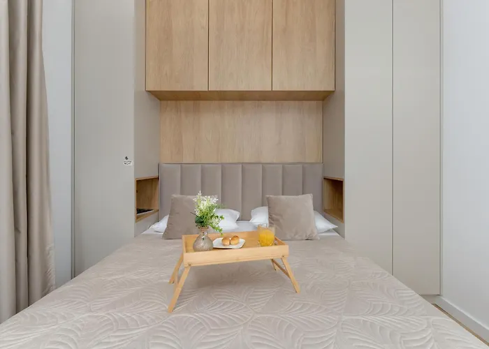 Bright Beige Apartment With Furnished Balcony And Parking In Gdansk By Noclegi Renters